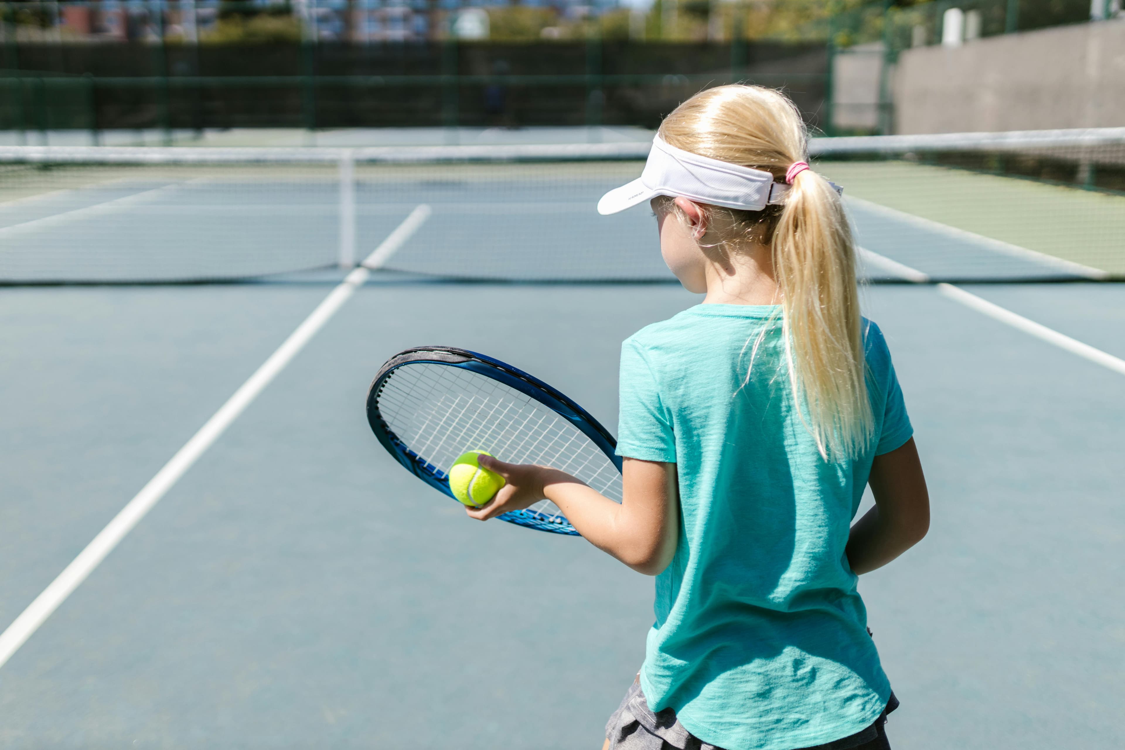 Child playing tennis